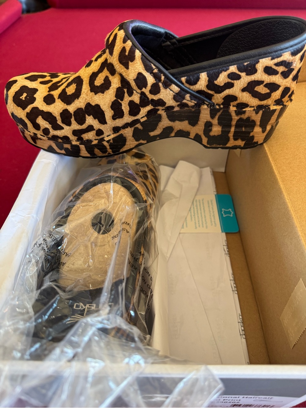 Dansko Leopard Print Clogs in Black and Tan